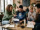 Traders collaborating in a cafe to analyze market trends using the MoonDog AI ($MDOGAI) ecosystem on Base.